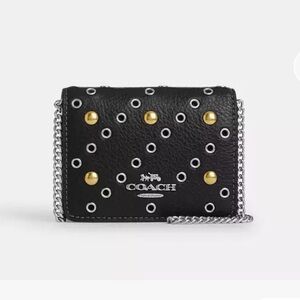 Coach Mini Wallet On A Chain
With Rivets